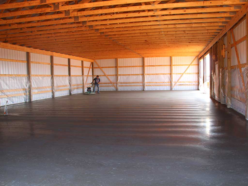 Rodgers concrete employee , finishing this concrete slab for a pole barn.